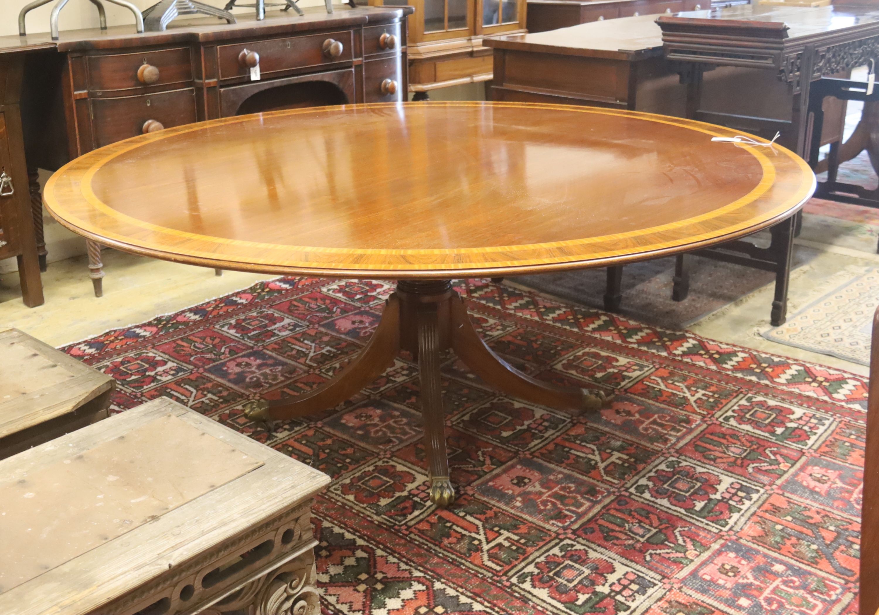 A William Tillman style satinwood banded circular mahogany breakfast table, diameter 184cm, height 75cm